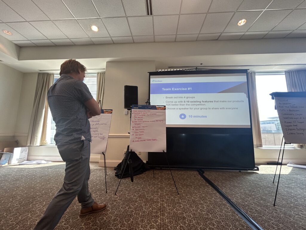 Andrew Gooch, Technical Content Developer & Solutions Architect, presents a team exercise at the More4apps Sales Kickoff event.